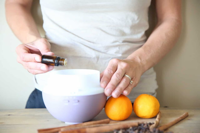 applying-essential-oil-to-diffuser