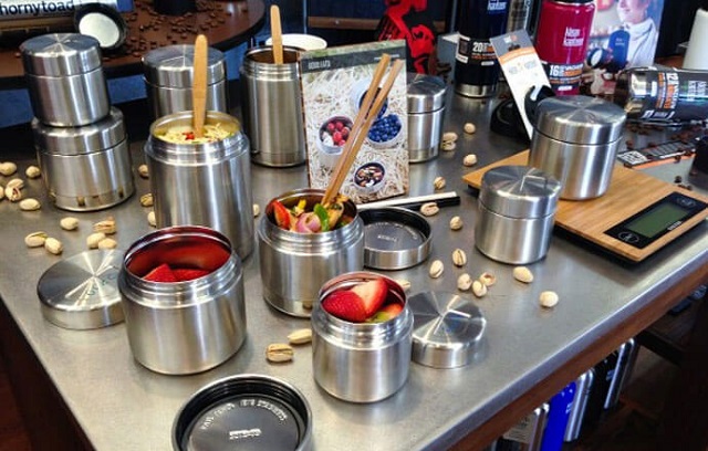 picture of klean kanteen canisters  with a lot sorts of food on the kitchen counter counter