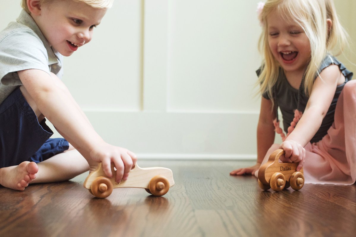 kids playing with wooden toys indoor