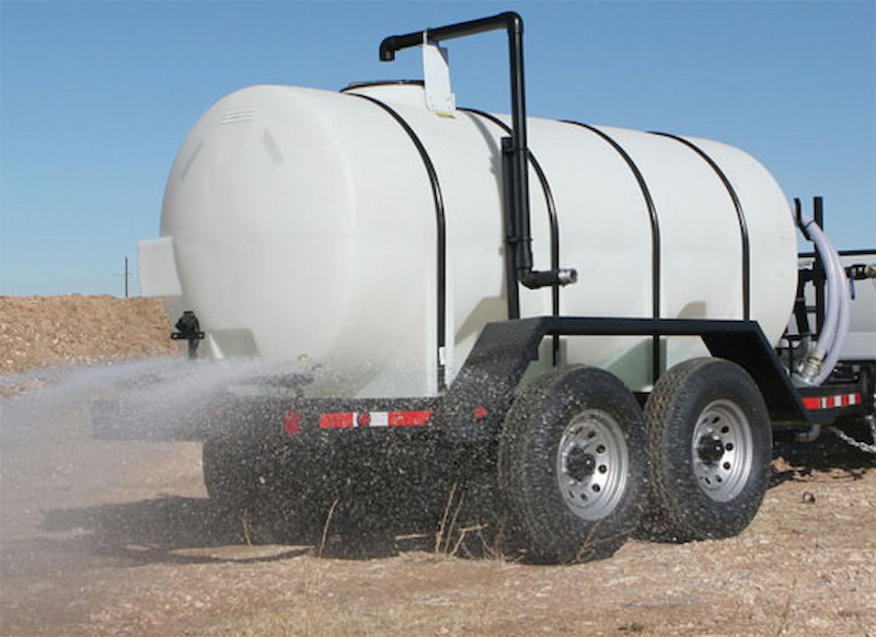 Water trailer watering the ground
