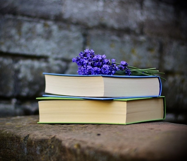 aromatherapy books on top with lavender flower