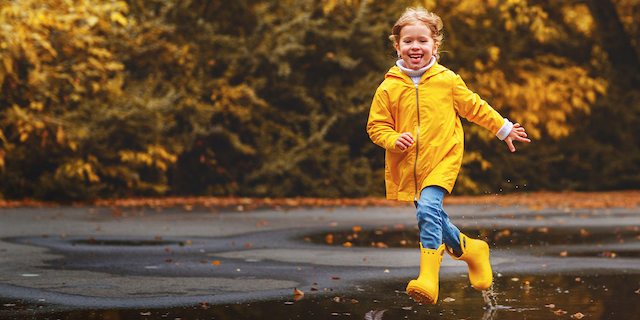 Little girl playing outside