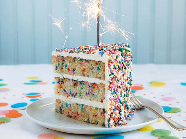 sprinkles rainbow cake slice on plate 