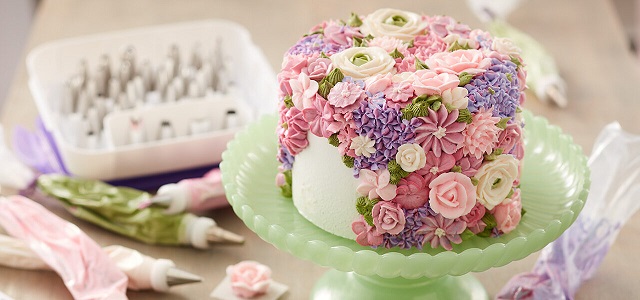 pink flower cake on platter 