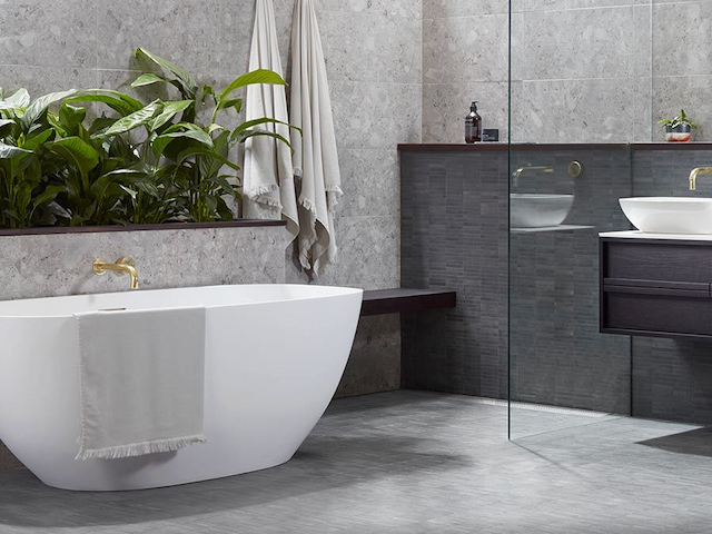 standalone tub in grey bathroom