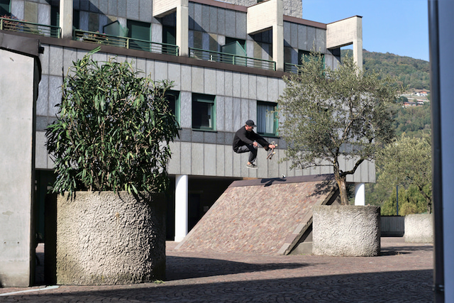 skater in black wearing minimalist baseball cap