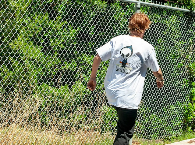 skater wearing graphic tee