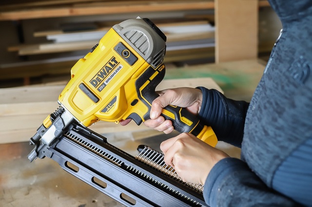 Close-up of holding DeWalt Farming Nail Gun