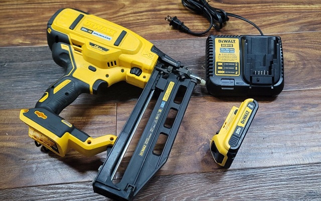Close-up of DeWalt finishing Nailer with battery and charger