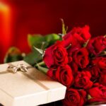 Bouquet of roses and unpacked present for Valentine's day