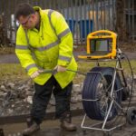 Man is using drain camera