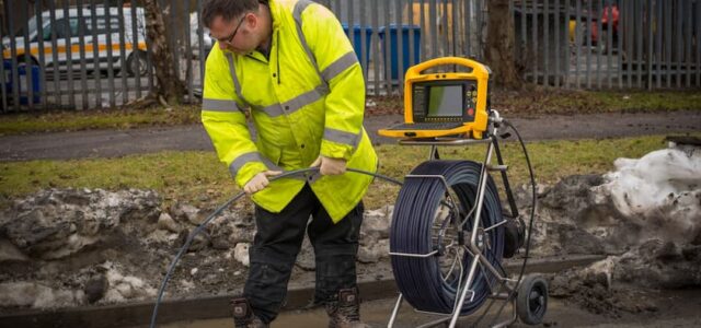 Man is using drain camera