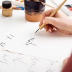 woman writing calligraphy on postcards