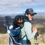 woman and dog with backpack