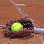 yellow ball bat and glove on the softball baseball field