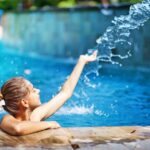 girl playing in pool
