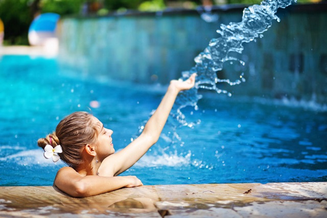 girl playing in pool