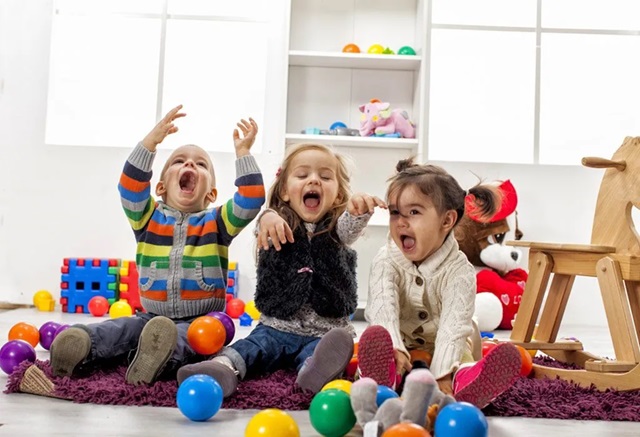 kids laughing and playing together 
