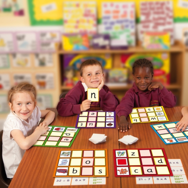 three kids playing spelling game - word builder