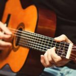 man playing Guitar