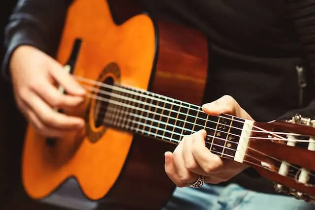 man playing Guitar