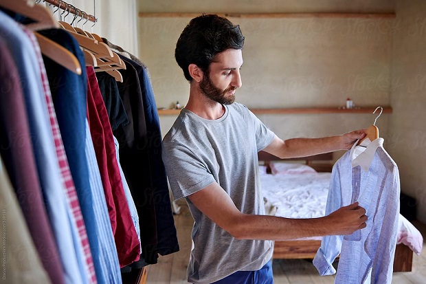 man choosing what to wear