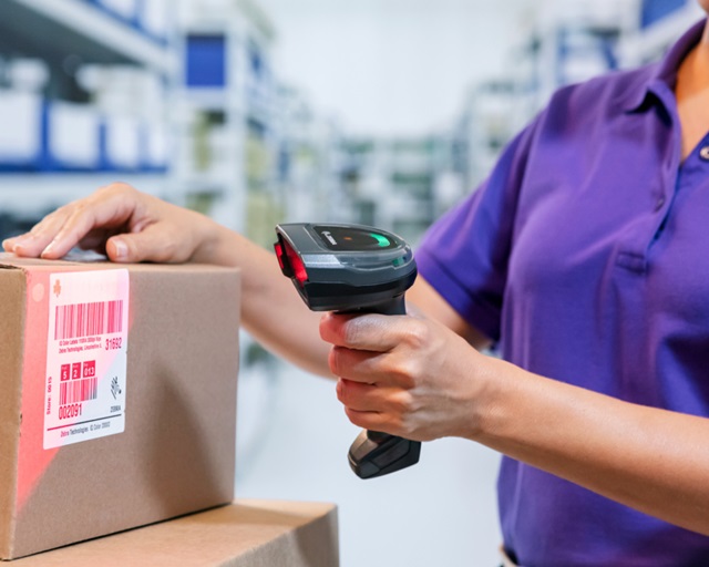 woman using barcode reader 