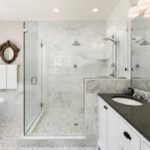 bathroom with glass enclosures