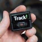 person holding gps tracker