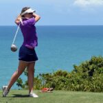 a woman playing golf