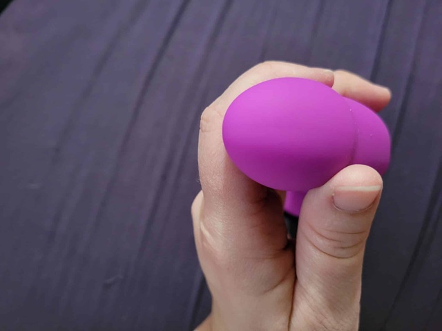 person holding suction dildo